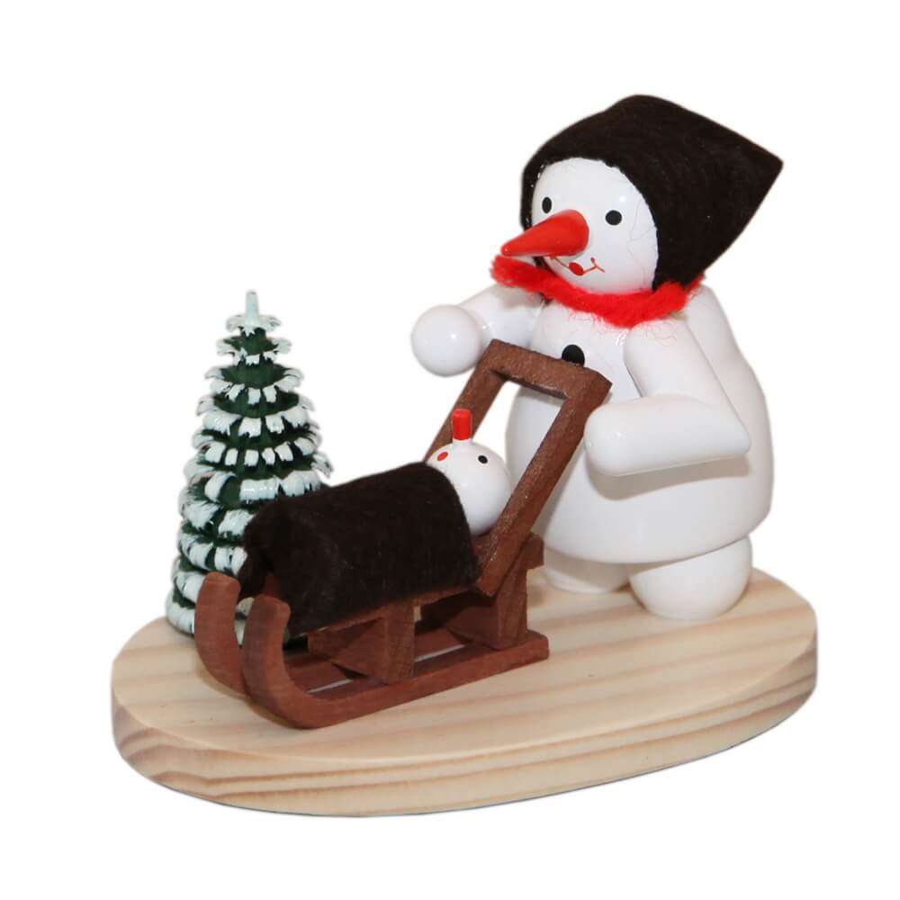 Miniature snowman - Mom with child in a sleigh by Ralf Zenker